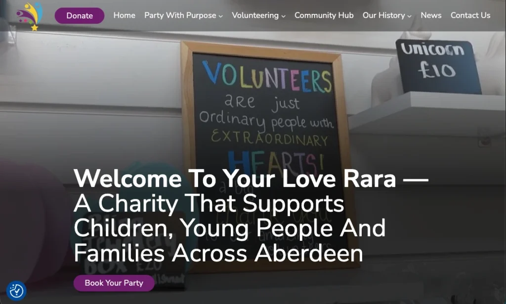A screenshot of the homepage for Your Love Rara, an Aberdeen charity. The hero section features a chalkboard that says 'Volunteers are just ordinary people with extraordinary hearts' and the headline 'Welcome To Your Love Rara'